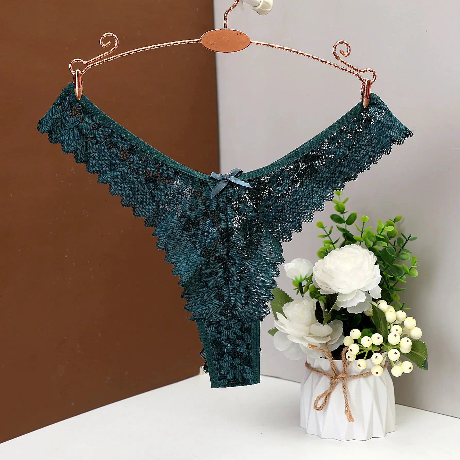 Teal lace thong by Simples Market, low-rise with scalloped edges and bow