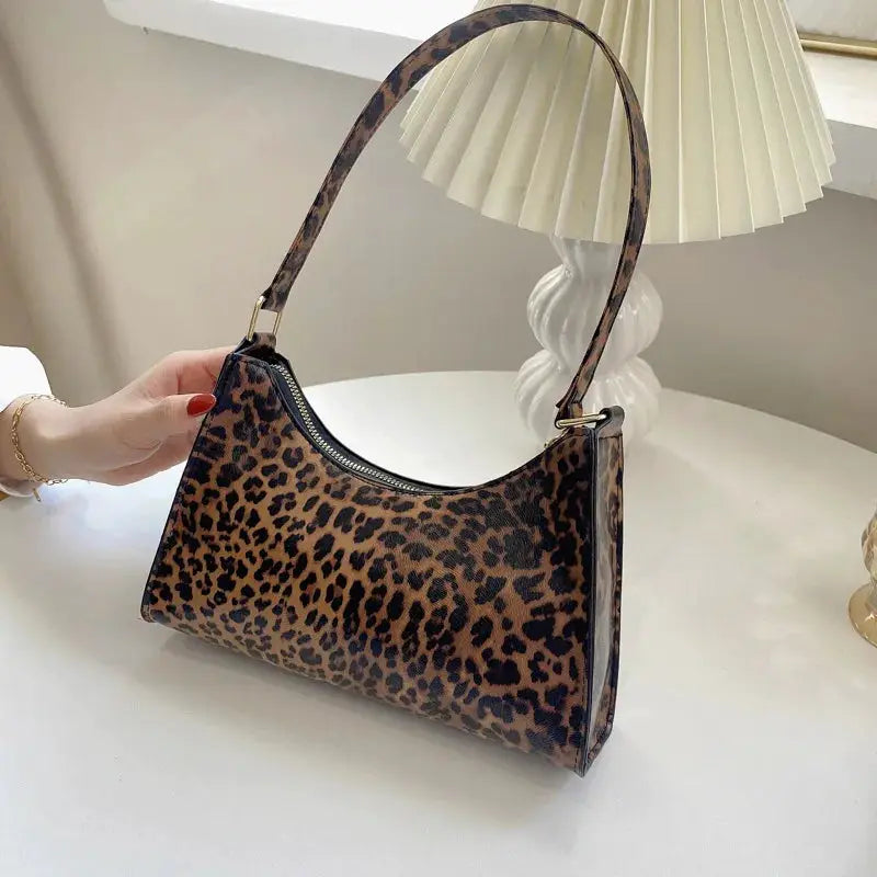 Leopard print PU leather shoulder bag by Simples Market with a curved single strap