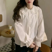 Simples Market white blouse with oversized ruffled Peter Pan collar and long puff sleeves