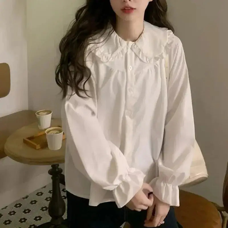 Simples Market white blouse with oversized ruffled Peter Pan collar and long puff sleeves