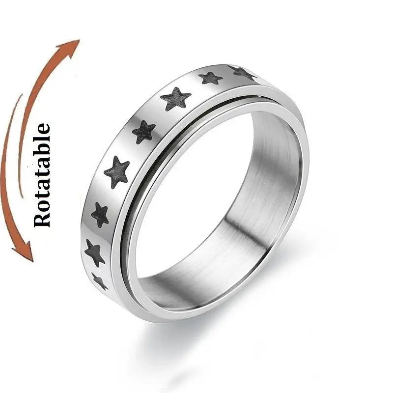 Stainless steel anti-stress fidget ring with a rotating outer band and star pattern.