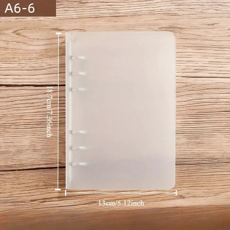 Clear A6 plastic ringed binder with six rings and clasp closure, translucent PP material