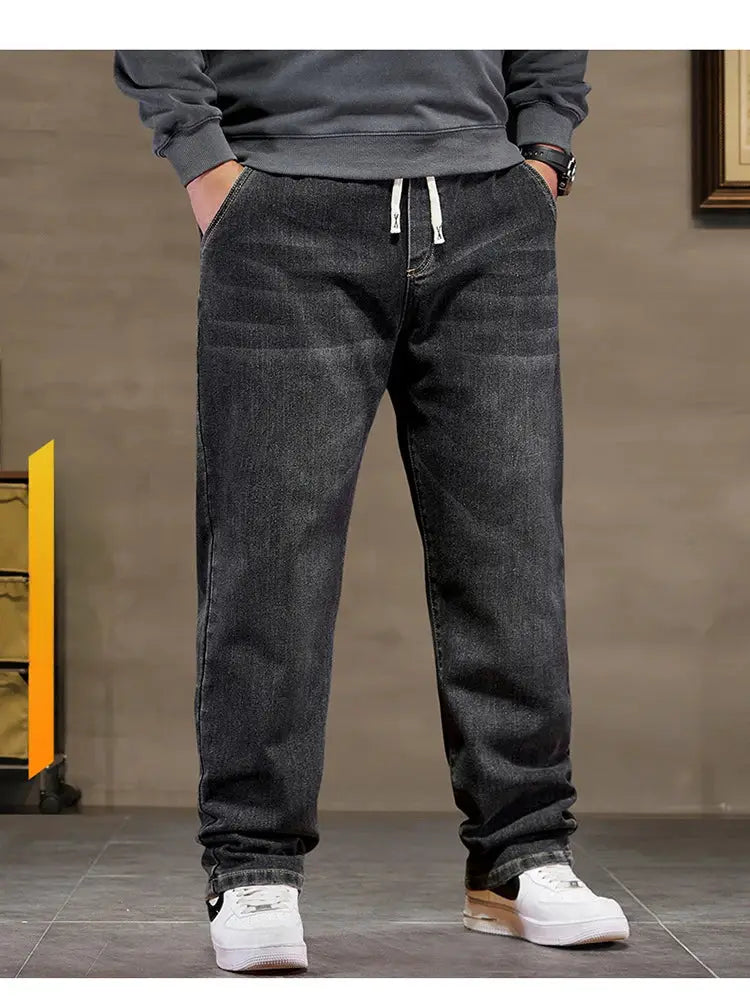Extra-big size men's baggy denim jeans with elastic waistband in classic black.