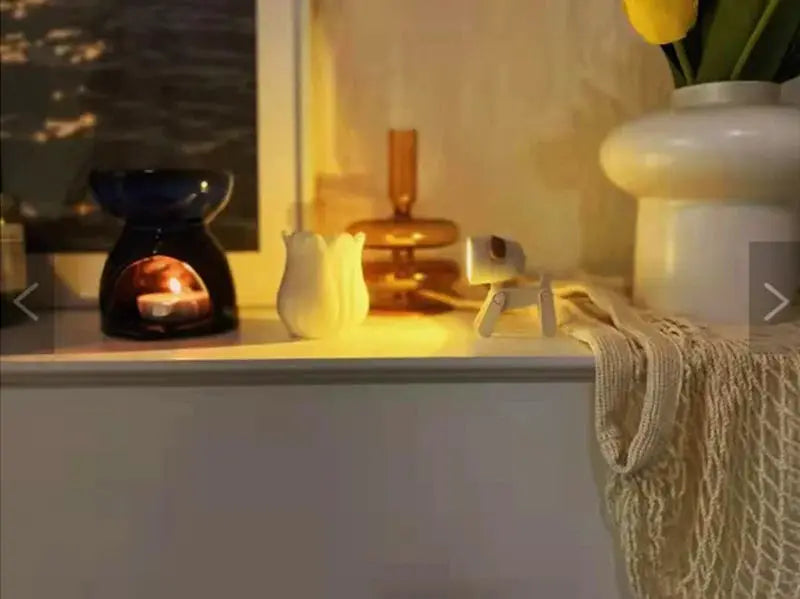 LED mini night light desk lamps featuring cute dog and deer shapes; warm white glow on a white shelf