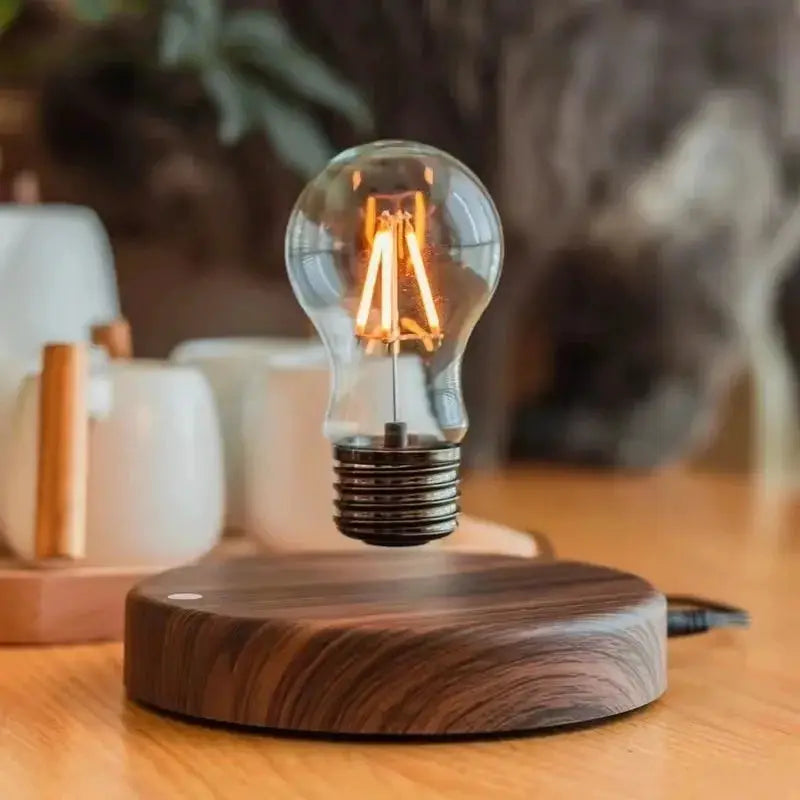Magnetic levitation lamp by Simples Market with floating glass LED bulb over a wooden base