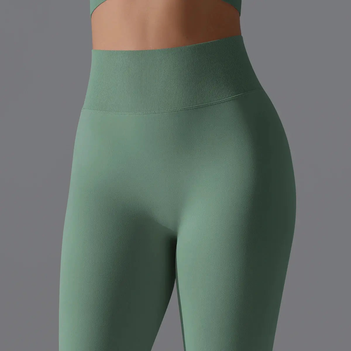 Simples Market women's seamless yoga leggings in sage green with a high-waist ribbed waistband.