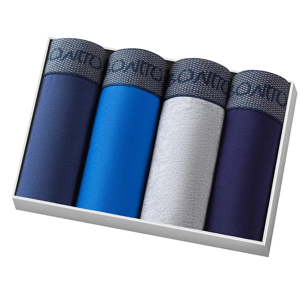 4-pack men's boxer shorts in navy, royal blue, heather gray, and purple with patterned waistbands