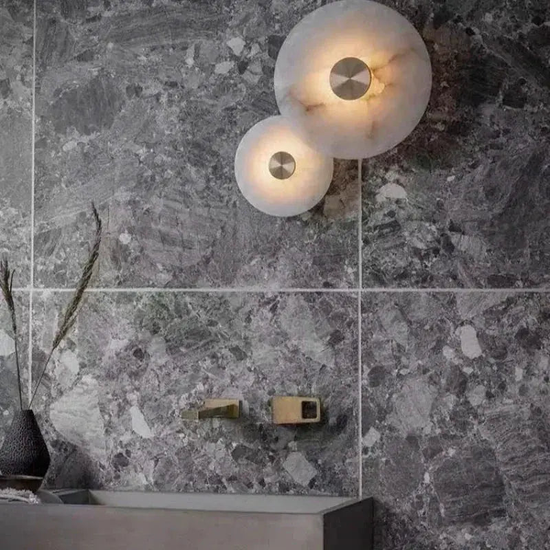 Luxury Spanish natural marble wall lamp by Simples Market with copper hardware and dual round glass shades
