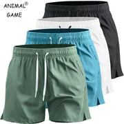 Set of five men's quick-dry athletic shorts in green, teal, blue, white, and black with pockets.