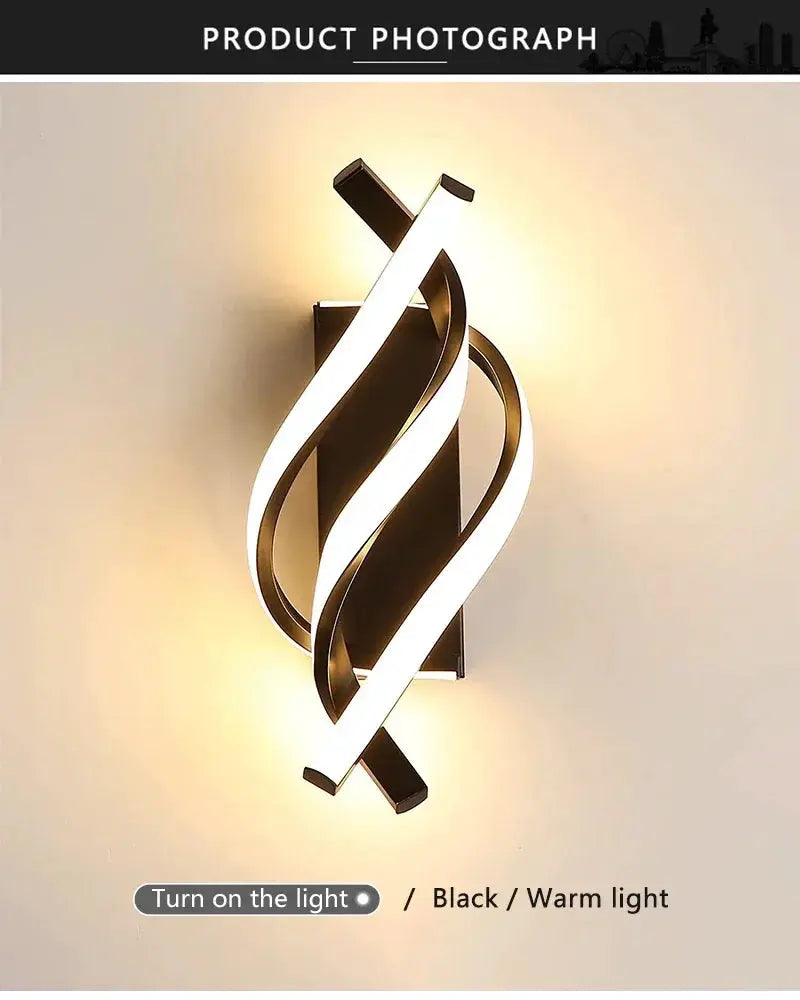 Curved spiral LED wall lamp in black with warm white light by Simples Market.
