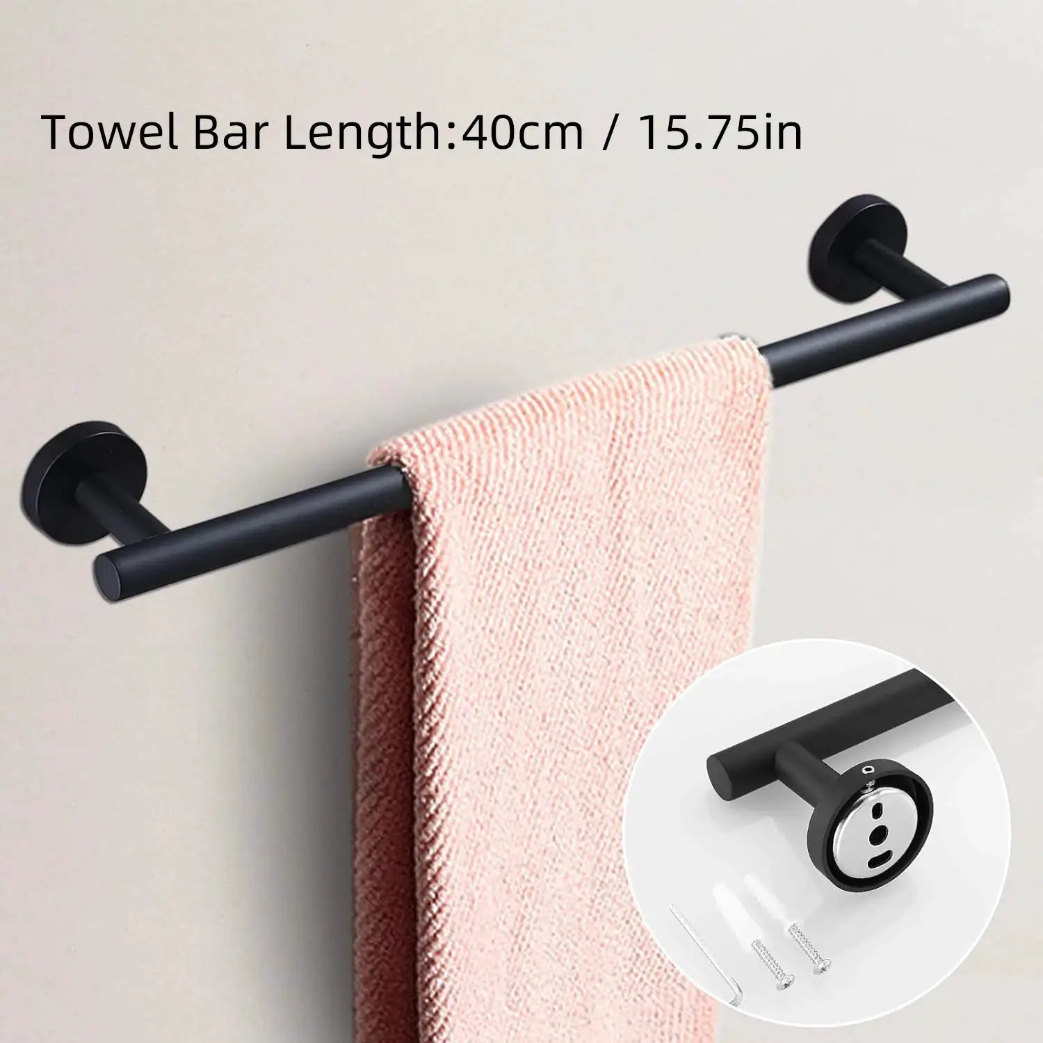 Matte black wall-mounted bathroom hardware set with towel bar, towel ring, and toilet paper holder; pink towel on bar.