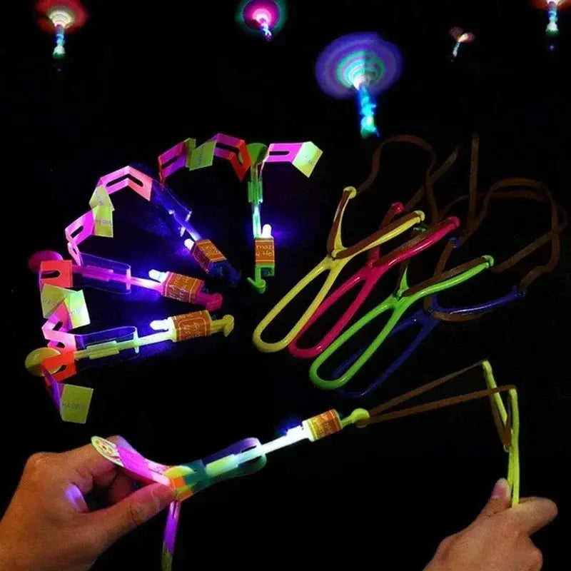 New Light Up Arrow Rocket Helicopter Flying Toys With LED Neon Glow For Parties And Gifts Rubber Band Catapult