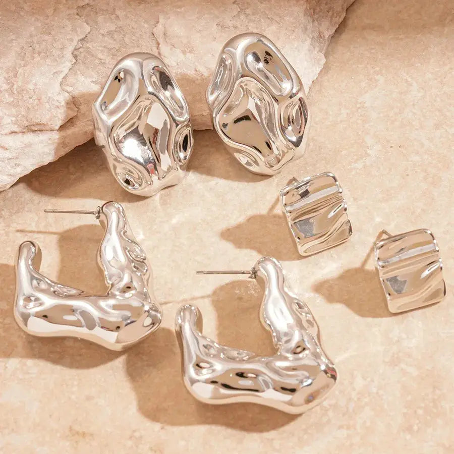 Silver-tone irregular acrylic stud earring set featuring oval, square and curved-hoop designs (6 pieces).
