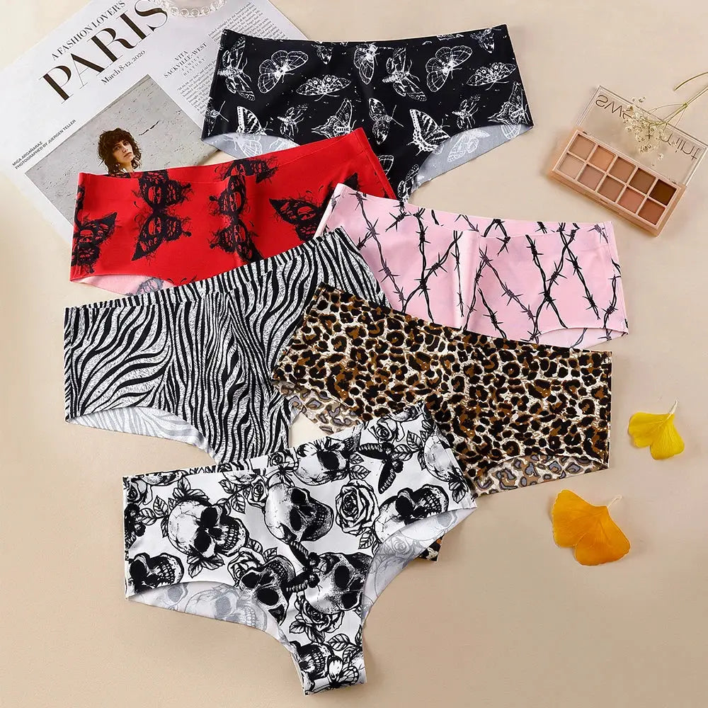 Six women's seamless print briefs in assorted patterns: butterfly, red lace, pink barbed wire, zebra, leopard, floral.