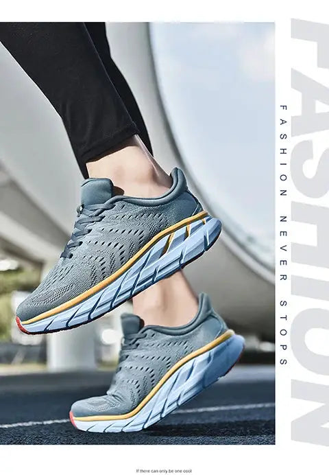 Men's running shoes with gray knit upper and cushioned blue/white sole with orange trim, 2 shoes shown