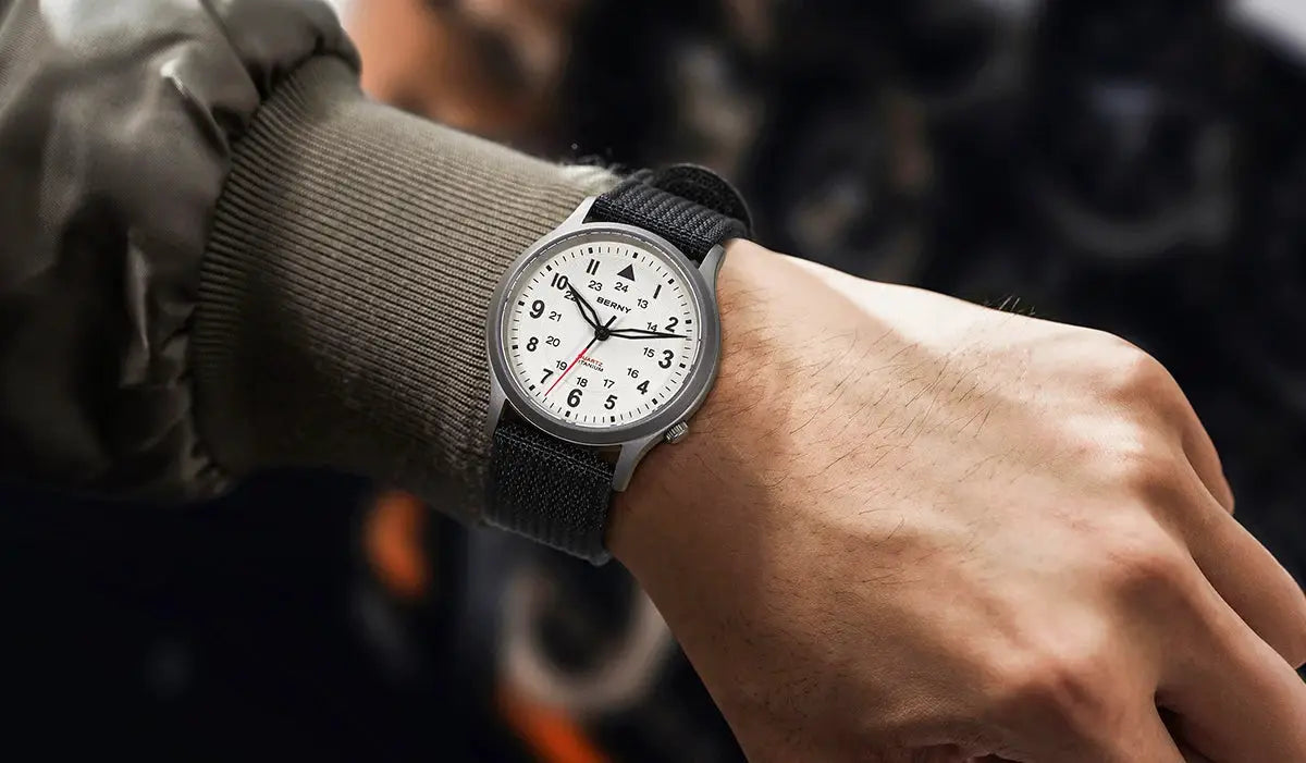 BERNY titanium field watch for men on a black fabric strap with a white easy-read dial.