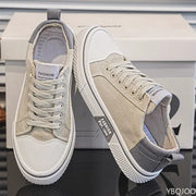 Men's beige canvas sneakers; lightweight breathable casual pair with white toe cap and sole