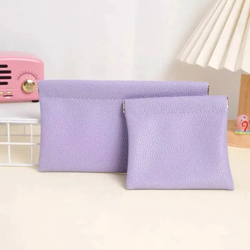 Two lavender artificial-leather pouches: a long wallet and a small passport/ID holder