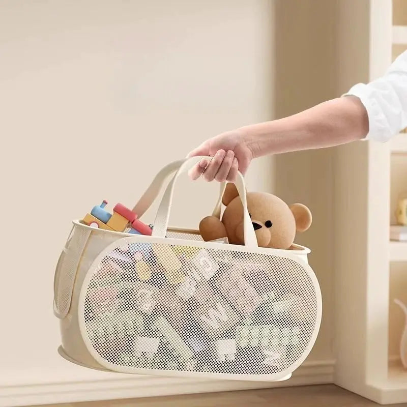 Portable large-capacity mesh toy storage bin in beige with white handles, filled with plush toys and a teddy bear
