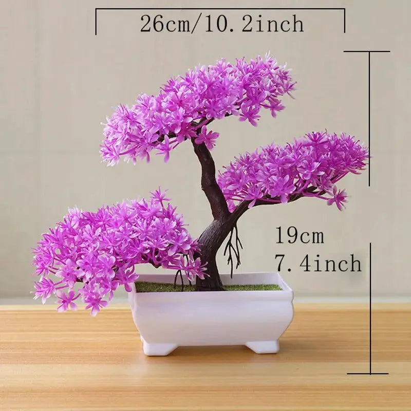 Artificial bonsai tree with pink blossoms in a white ceramic pot by Simples Market