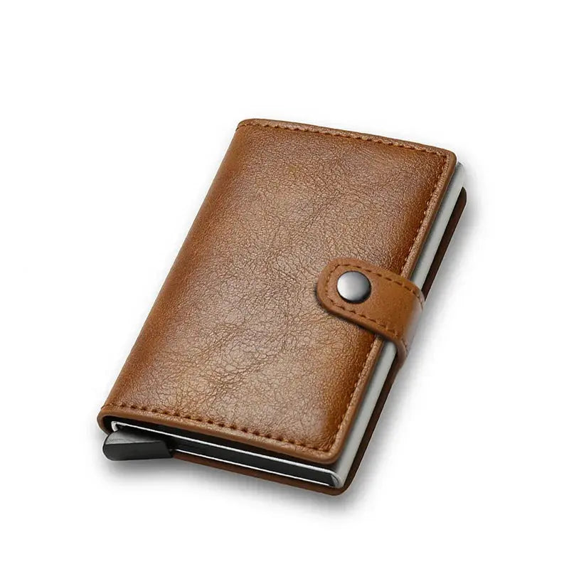 Brown leather minimalist card wallet with snap strap by Simples Market