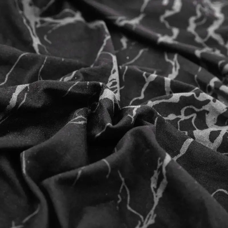 Geometric print sofa cover by Simples Market, black with gray pattern, elastic slipcover.