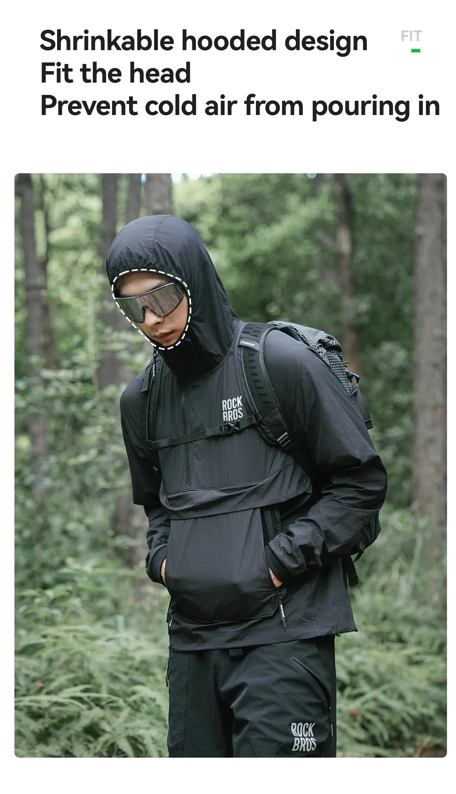 ROCKBROS Cycling Waterproof Jacket in black with hood, worn with backpack in a forest.