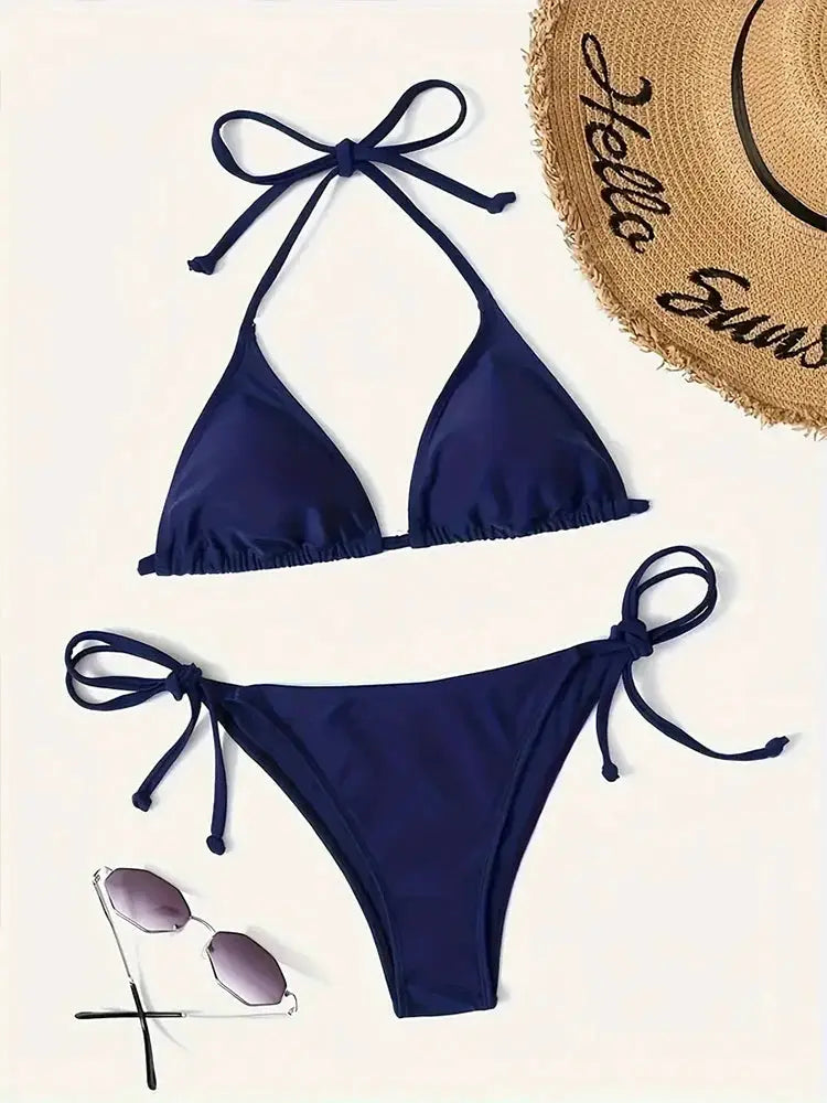 Bikini set navy blue by Simples Market with triangle halter top and tie-side bottoms.