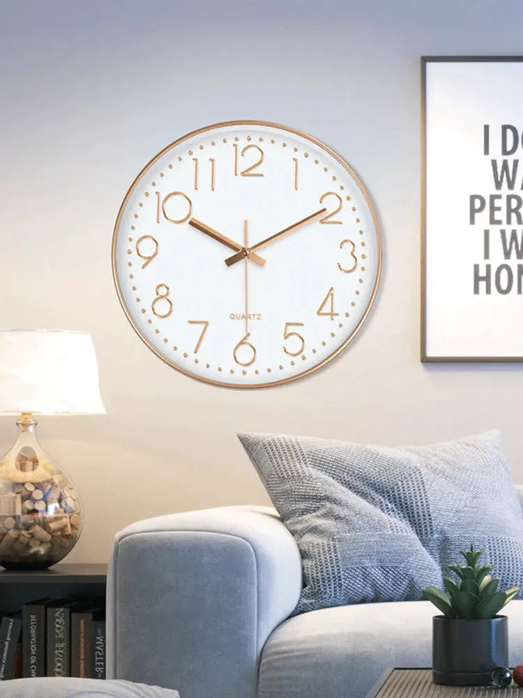 Analog quartz wall clock by Simples Market, white dial with gold frame and numerals