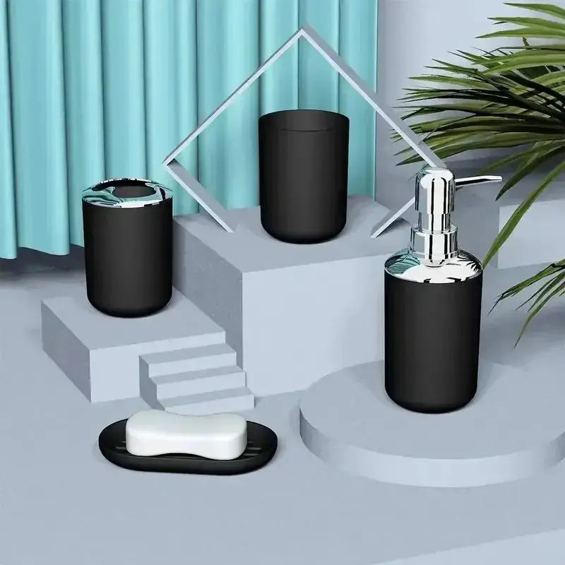 4-piece bathroom set in gray and black plastic: toothbrush holder, cup, soap dispenser, and soap dish
