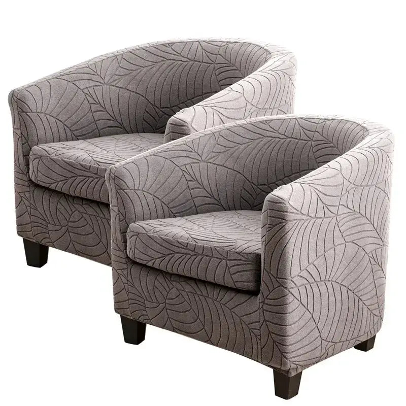 Two grey Leaves Jacquard tub chair slipcovers in stretch fabric for living room.