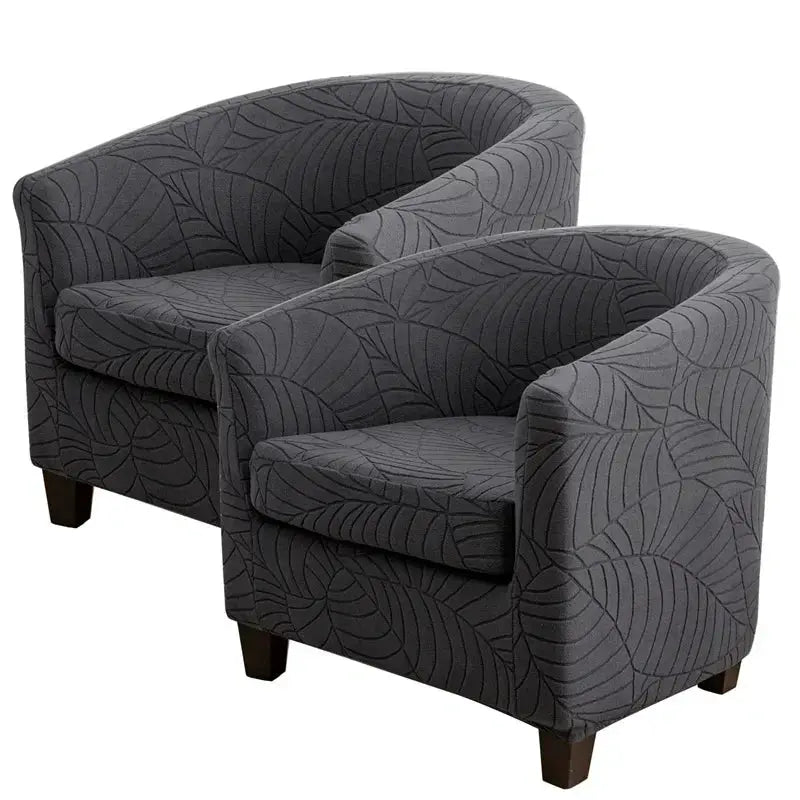 Leaves jacquard tub armchairs in dark gray fabric with curved backs and wooden legs.
