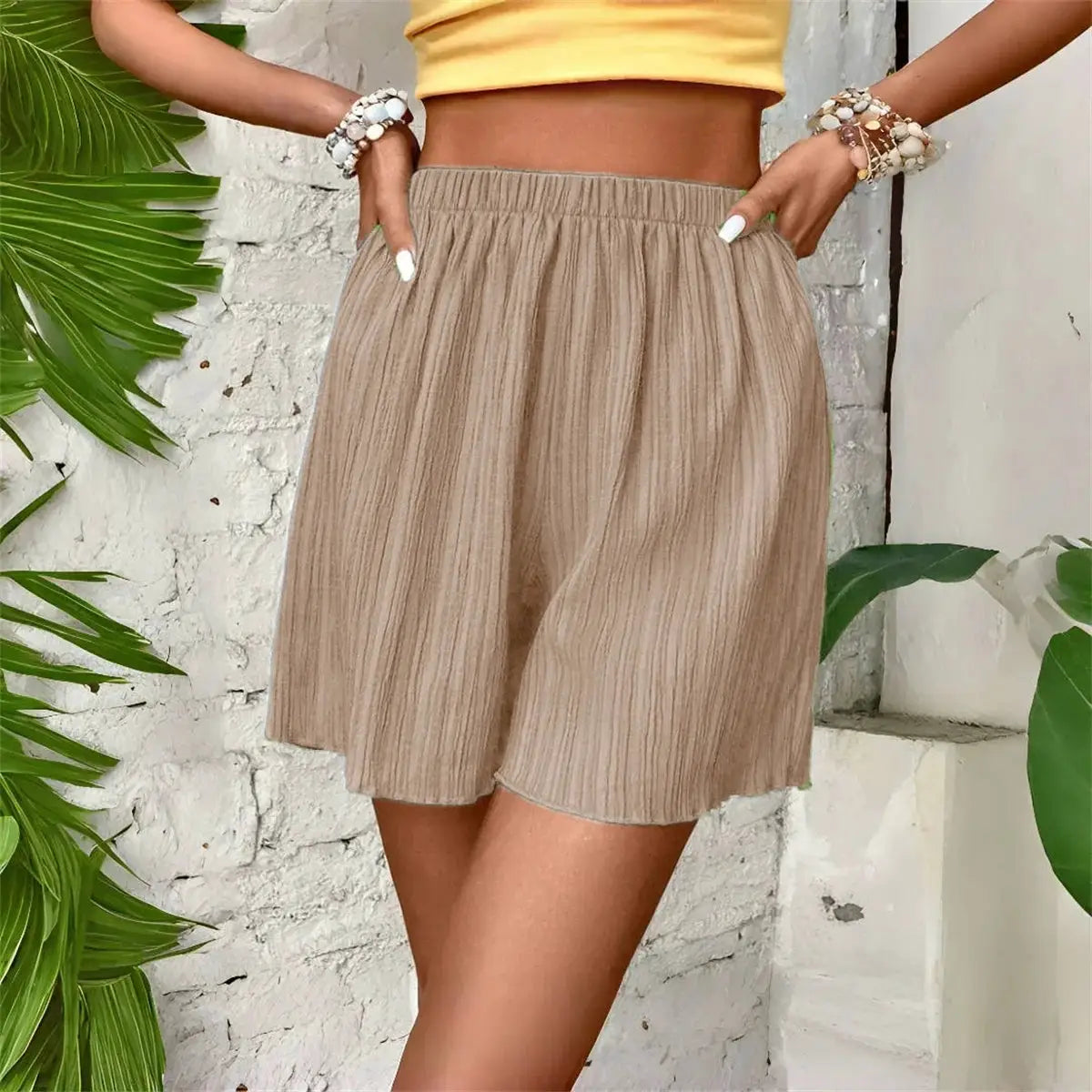 Women's beige elastic-waist short pants with subtle vertical texture by Simples Market