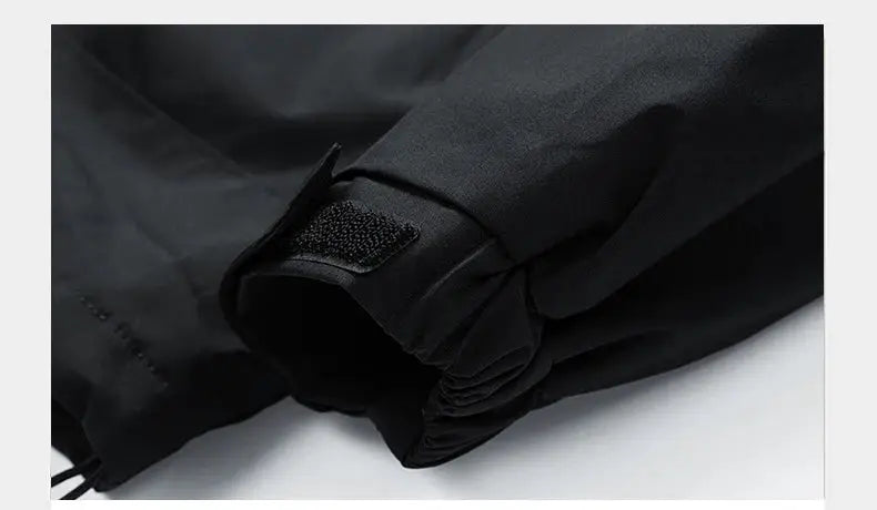 Men's black softshell windbreaker hooded jacket by Simples Market with waterproof design, zip front and adjustable cuff.