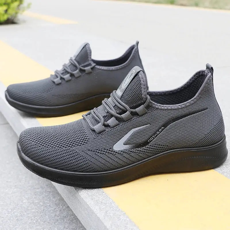 Pair of men's gray knitted running shoes, Simples Market, lightweight breathable, non-slip sole.
