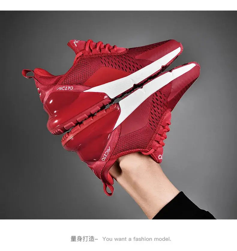 Red mesh men's running sneakers with white platform sole and breathable upper