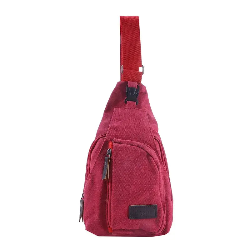 Simples Market men's vintage red canvas sling bag with front zip pockets and logo patch