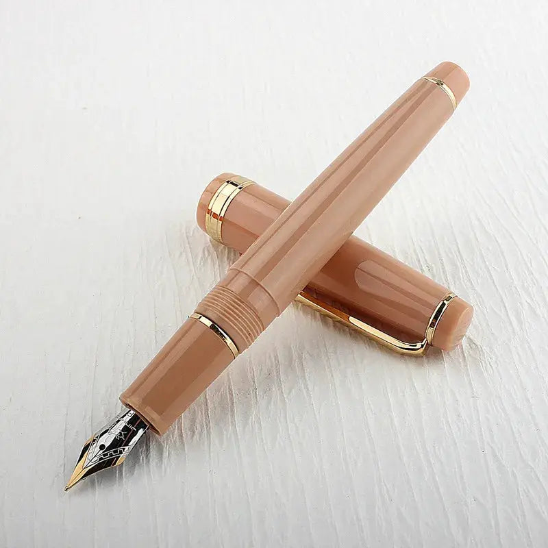 Two beige acrylic Jinhao 82 fountain pens with gold trim and caps, Simples Market