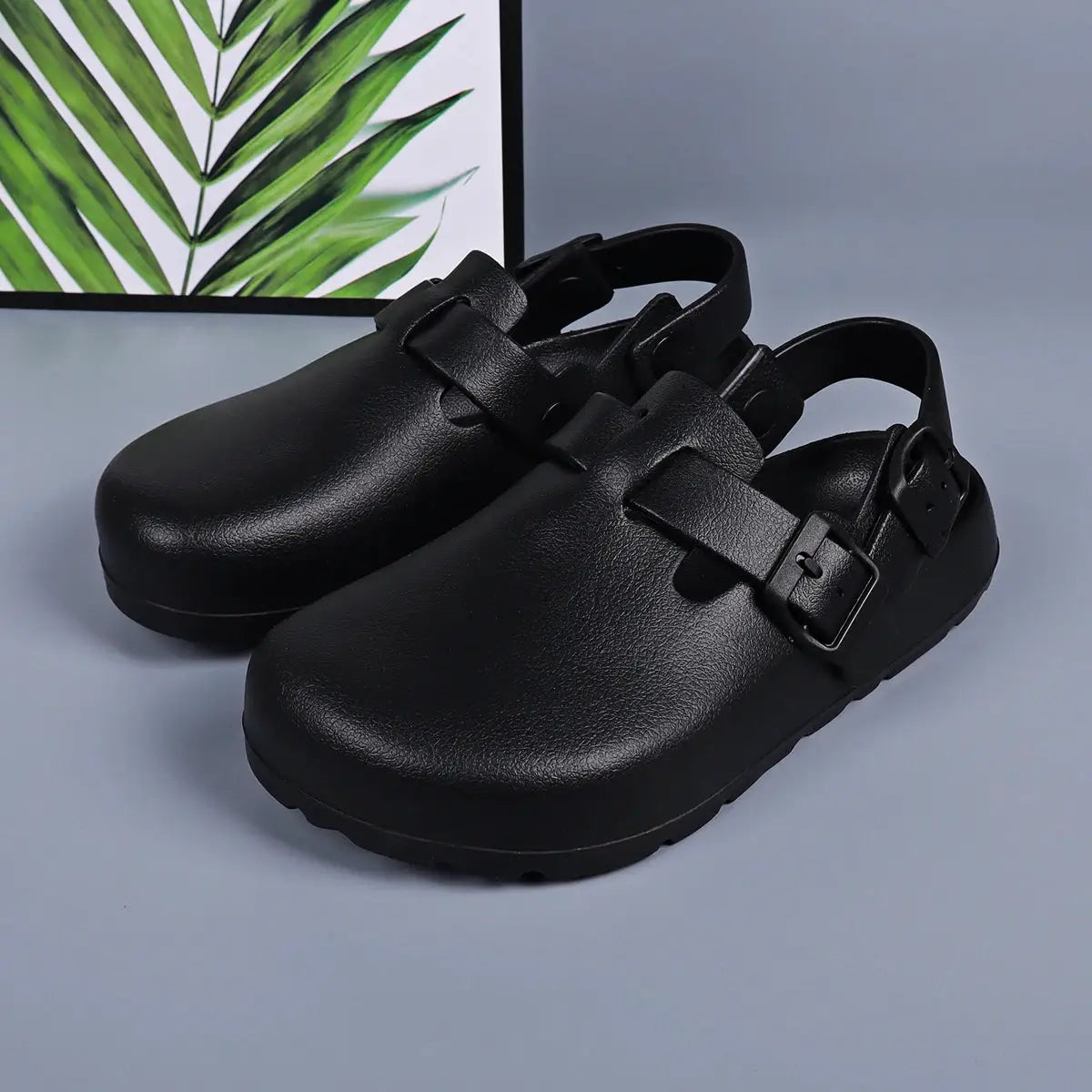Women platform clogs with adjustable buckle strap in black by Simples Market