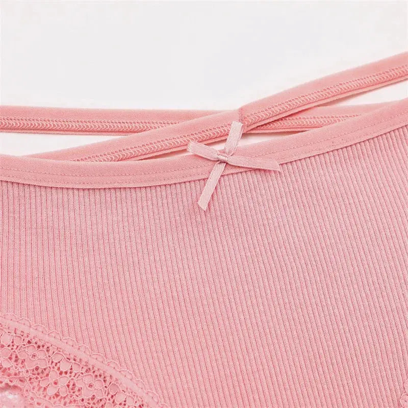 Women's pink cotton briefs with ribbed texture, lace trim and bow detail.