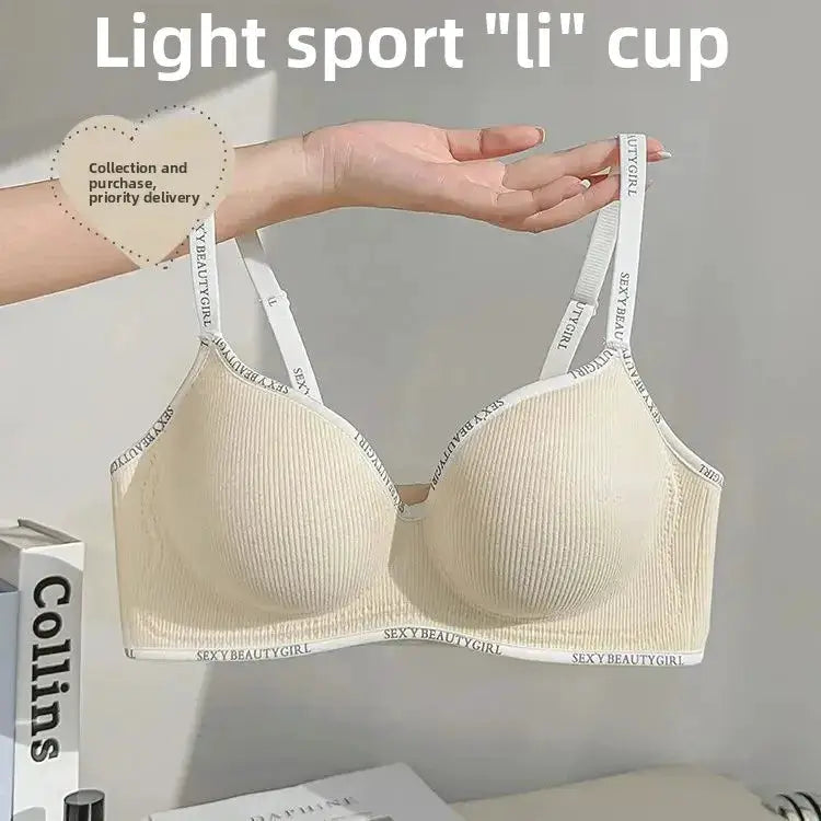 Wireless push-up bra in beige, seamless ribbed cups with adjustable straps featuring printed text.