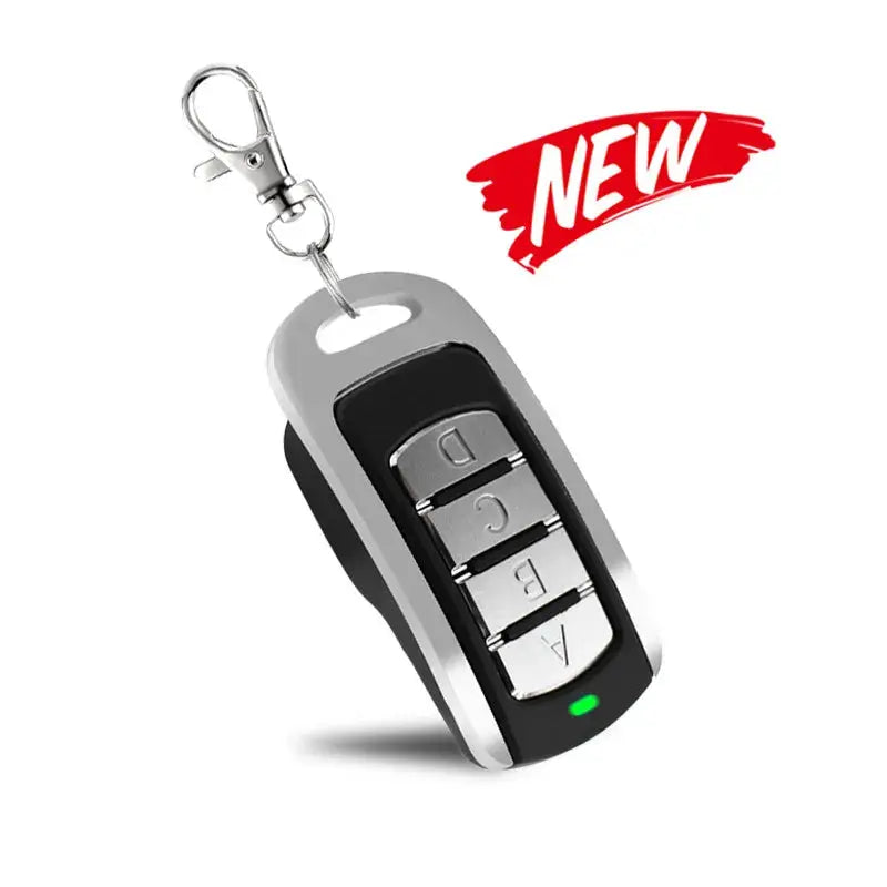 Universal garage door remote key fob with four metal buttons, multi-frequency 280-868MHz, on a keychain.