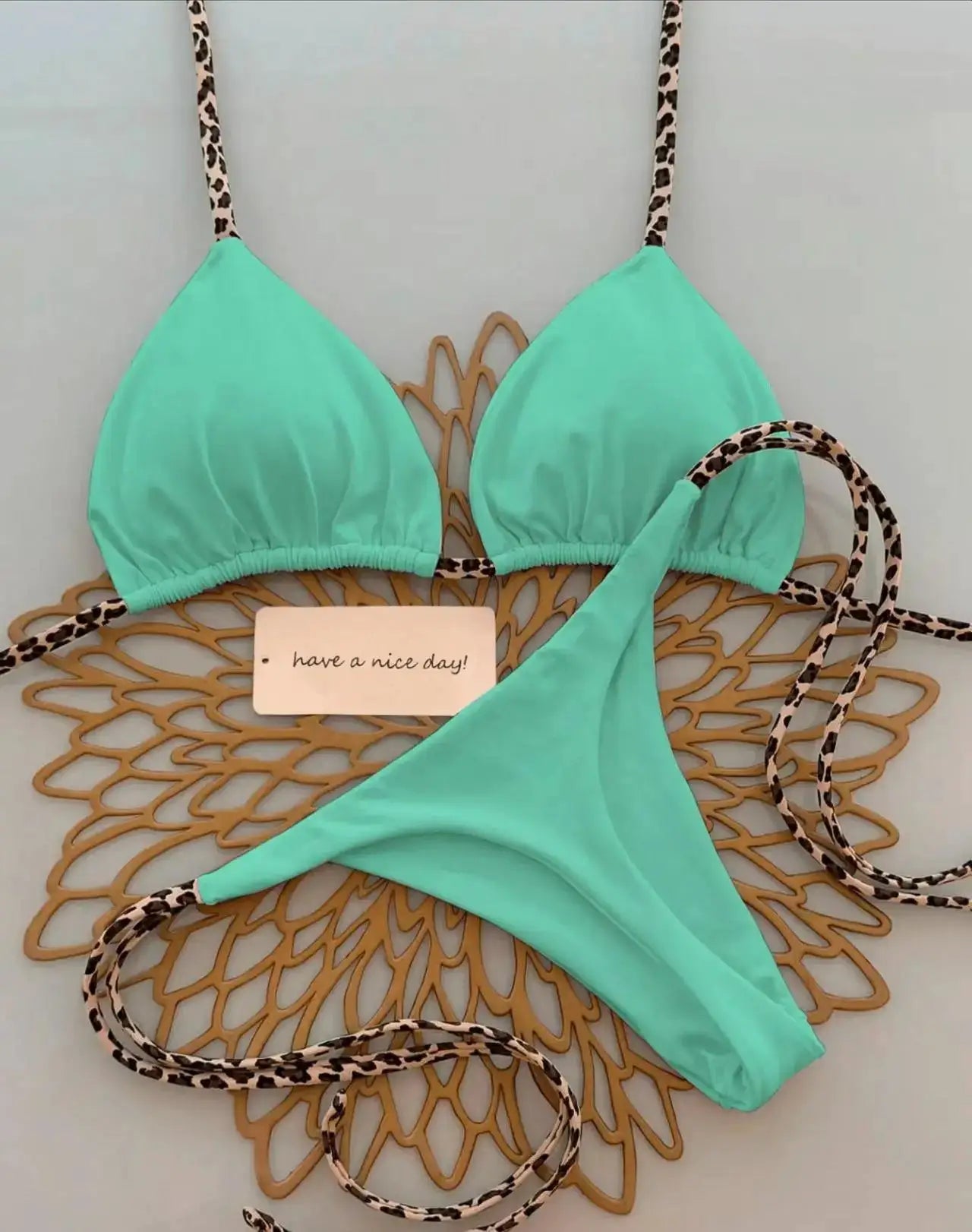 Simples Market mint green bikini set with leopard print straps and thong bottoms