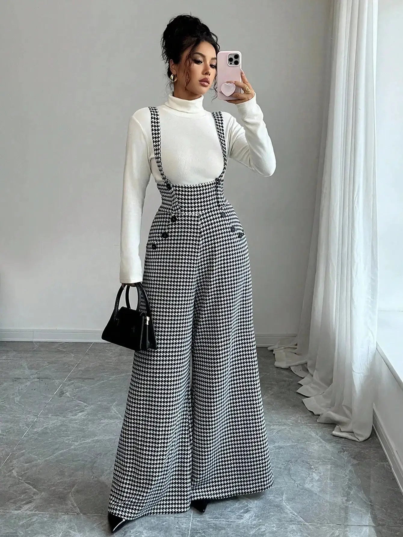 Overalls for women in black-and-white houndstooth with wide-leg suspender straps