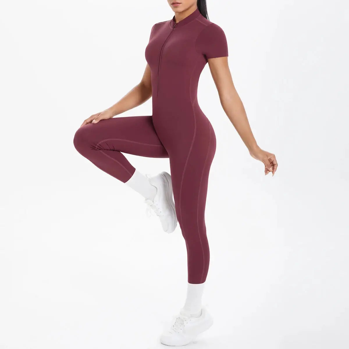 Women's burgundy short-sleeve fitness jumpsuit with front half-zip, one-piece athletic bodysuit.
