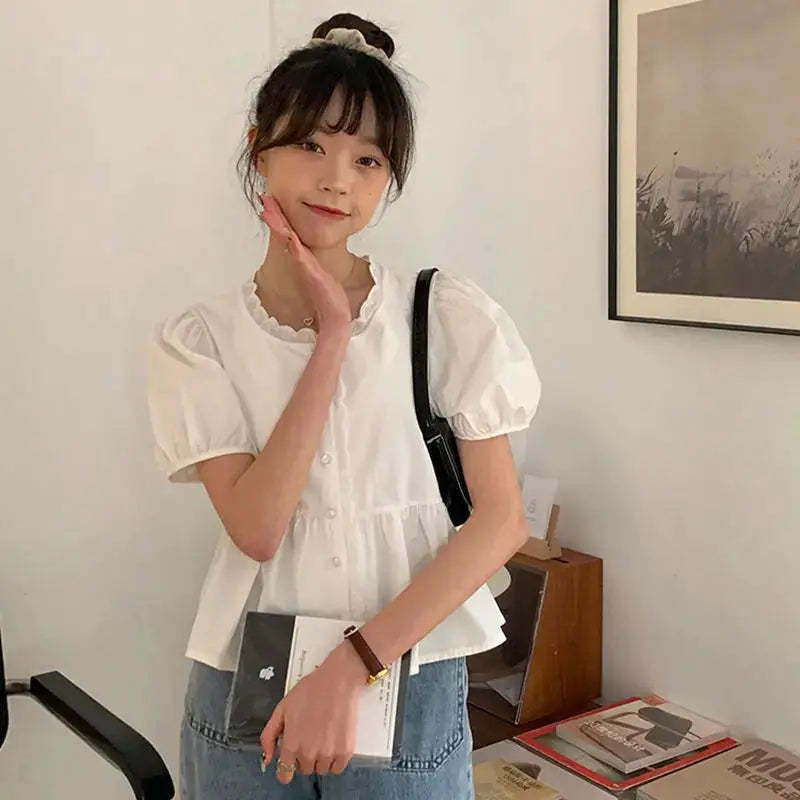 Women’s white peplum blouse with short puff sleeves by Simples Market