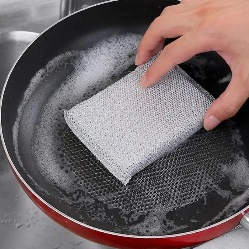 Simples Market gray textured kitchen dishwashing sponge pad used to scrub a pan