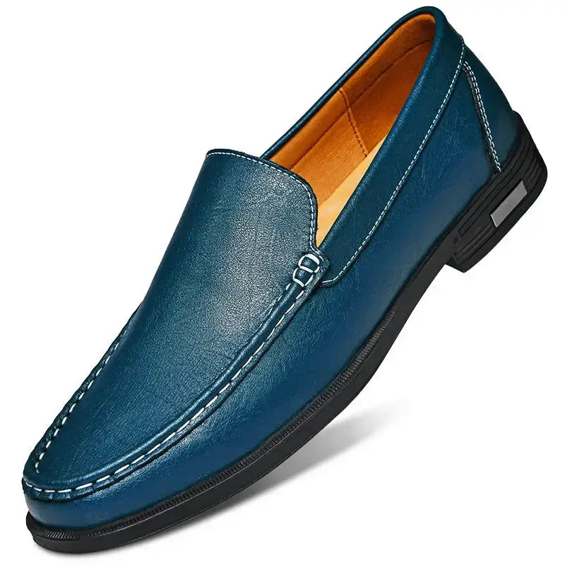 Men's blue leather slip-on dress loafer with moccasin stitching and decorative strap buckle