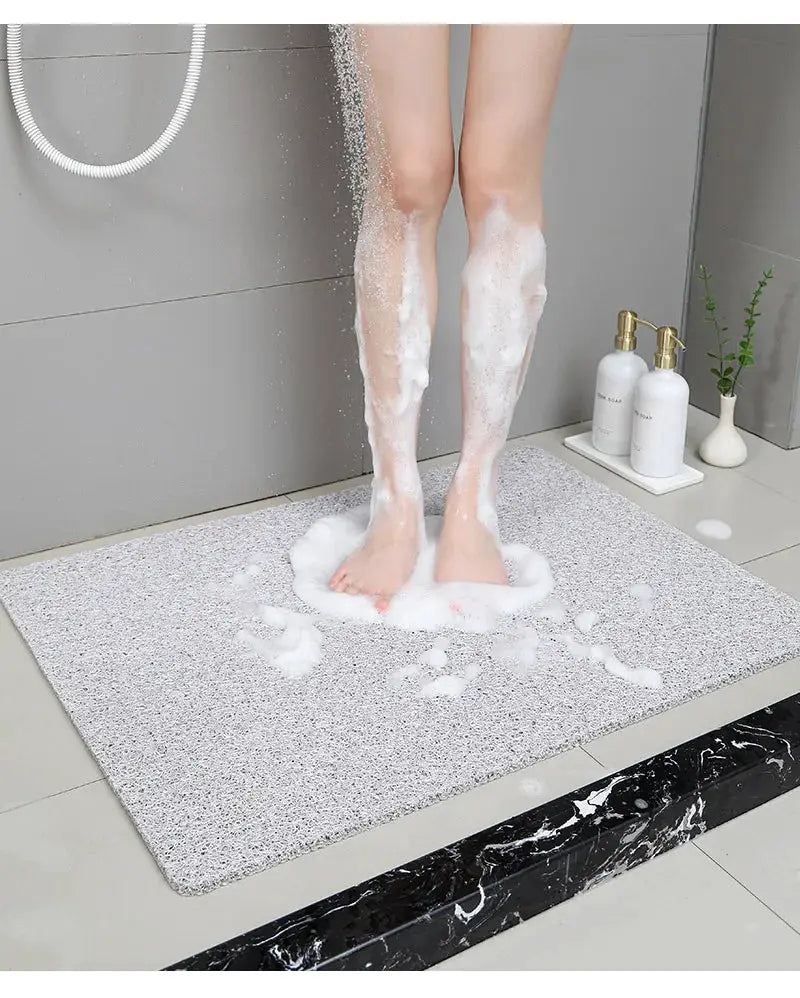 Non-slip hollow bath mat by Simples Market; grey quick-drying foot-massage shower mat.