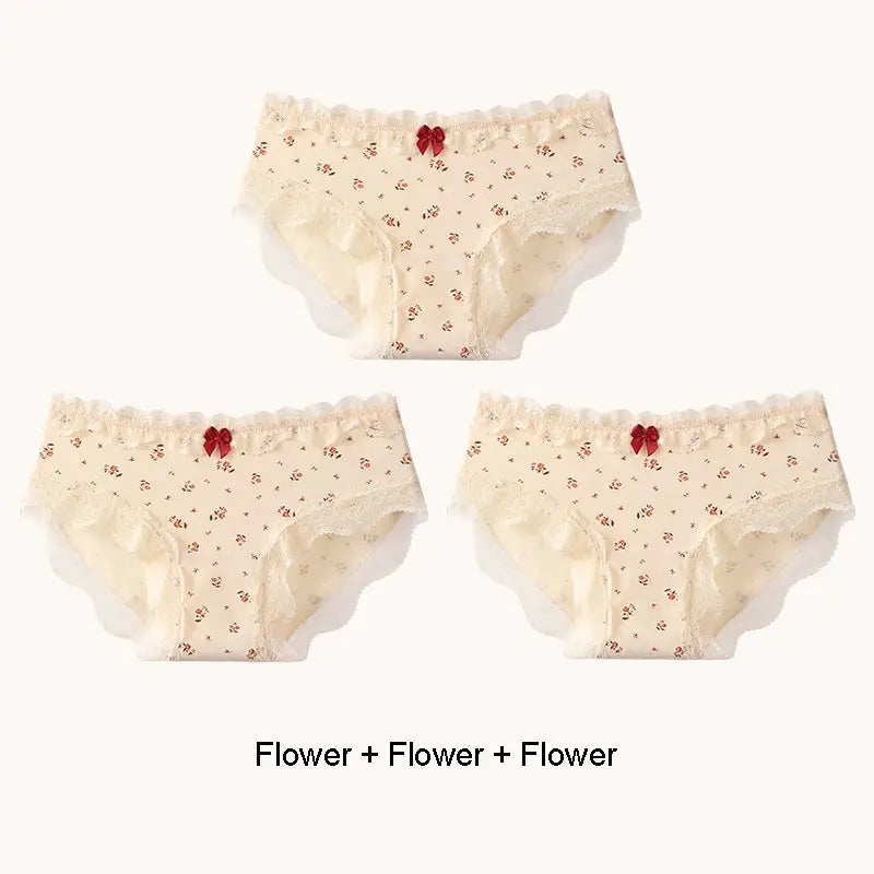Three-pack ivory floral cotton lace-trim briefs by Simples Market with red bows